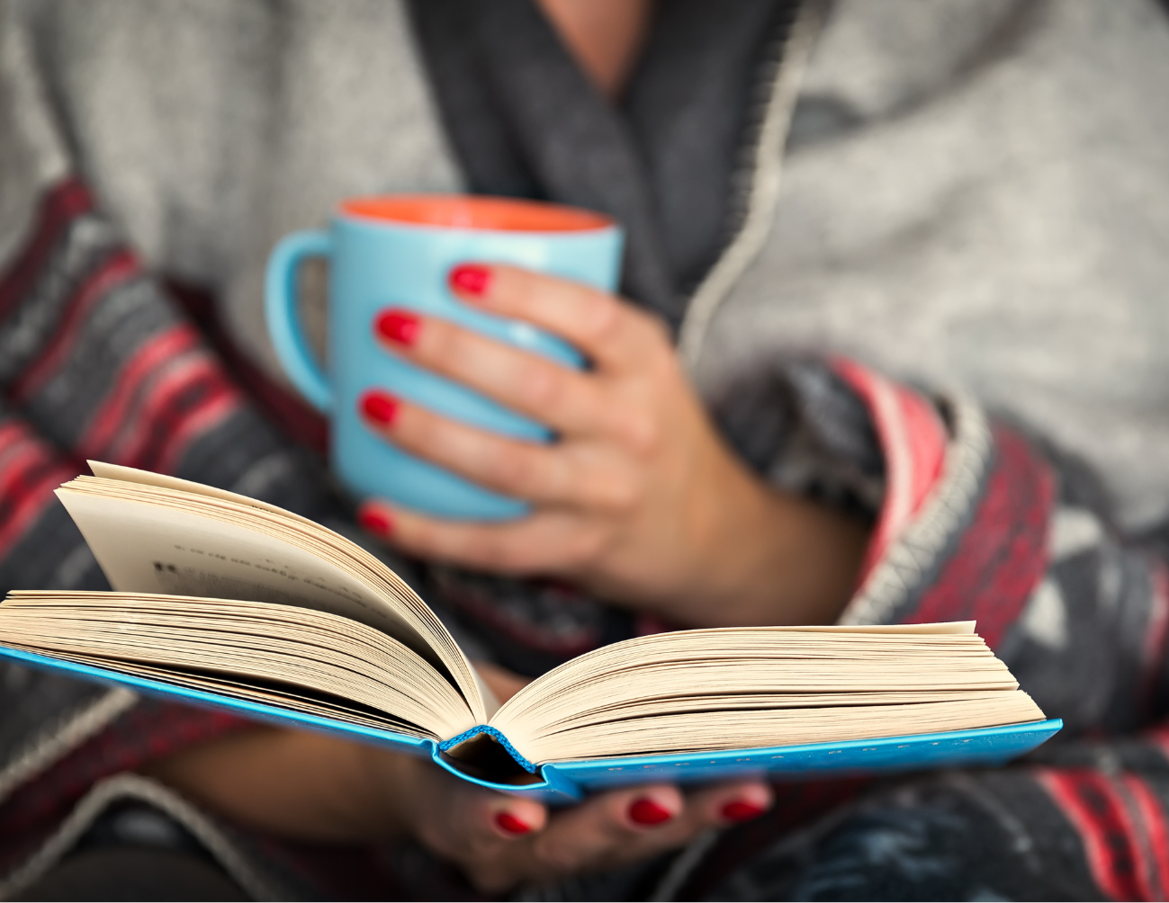 Open book with a coffee mug